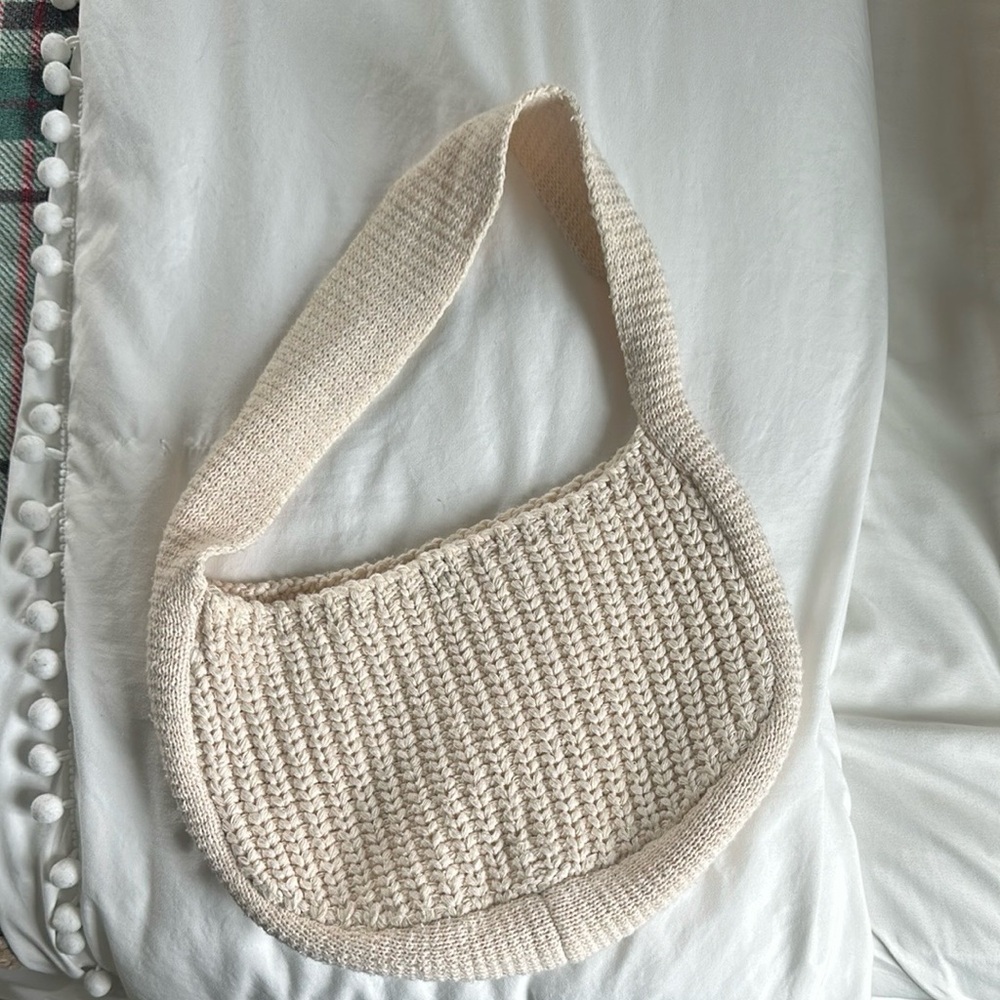 Cream Shoulder Bag with Knitted Material Wide Strap and Crescent Shape